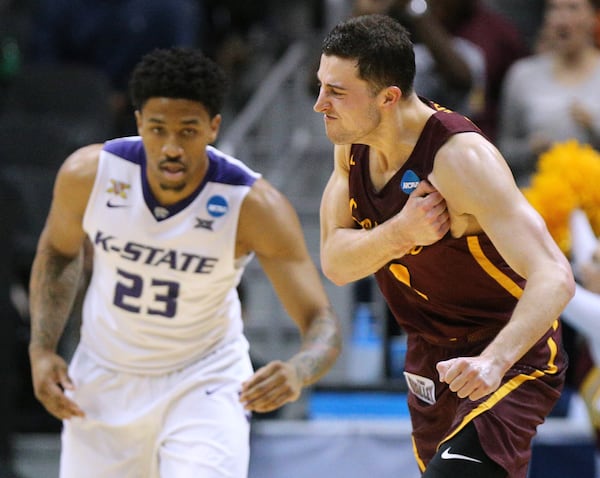 March 24, 2018 Atlanta: Loyola guard Ben Richardson pumps his chest after hitting a three pointer against Kansas State guard Amaad Wainright on the way to a 78-62 victory in their regional final NCAA college basketball game on Saturday, March 24, 2018, in Atlanta.  Curtis Compton/ccompton@ajc.com