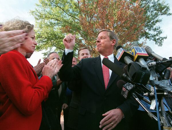 Johnny Isakson gives a thumbs up to a crowd gathered at Marietta Square on Nov. 11, 1998, where he announced he would run for the U.S. House seat being vacated by then-Speaker Newt Gingrich. (PHOTO BY CELINE BUFKIN/STAFF)