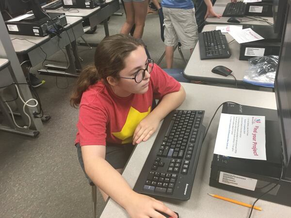 Lily Mahan looks over her entry into the 2018 WhizLearning Kids Scratch Competition on May 18 at Suwanee Elementary School. The fifth-grader said she’s interested in a career in computer programming when she grows up. Arlinda Smith Broady/AJC