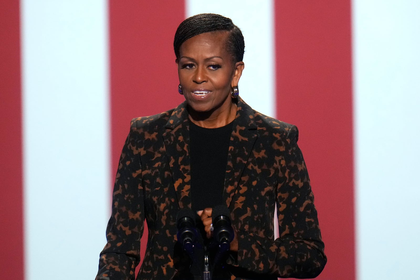 Former first lady Michelle Obama speaks at a campaign rally for democratic presidential nominee Vice President Kamala Harris at the Wings Event Center, in Kalamazoo, Mich., Saturday, Oct. 26, 2024. (AP Photo/Paul Sancya)