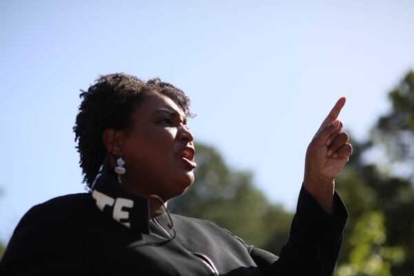 Former Georgia Minority Leader Stacey Abrams speaks to dozens of Raphael Warnock supporters during Election Day; the democratic candidate try to flip the State Senate to a democratic side on Tuesday, Nov. 3, 2020, 
Miguel Martinez for The Atlanta Journal-Constitution