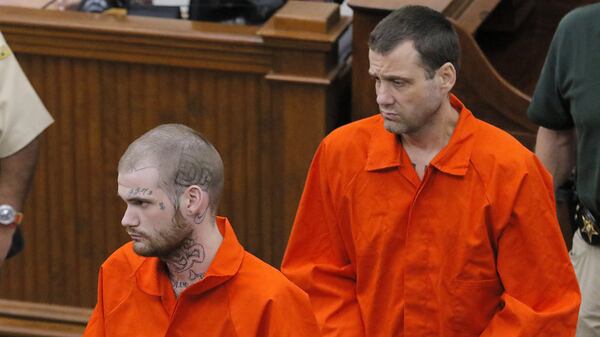 Ricky Dubose (front) and Donnie Russsell Rowe enter the Putnam County Courthouse on June 21, less than a week after they were captured. Dubose and Rowe are accused of killing two prison guards in a brazen escape. District Attorney Stephen Bradley gave official notice Tuesday that he will seek the death penalty for the two inmates. BOB ANDRES /BANDRES@AJC.COM