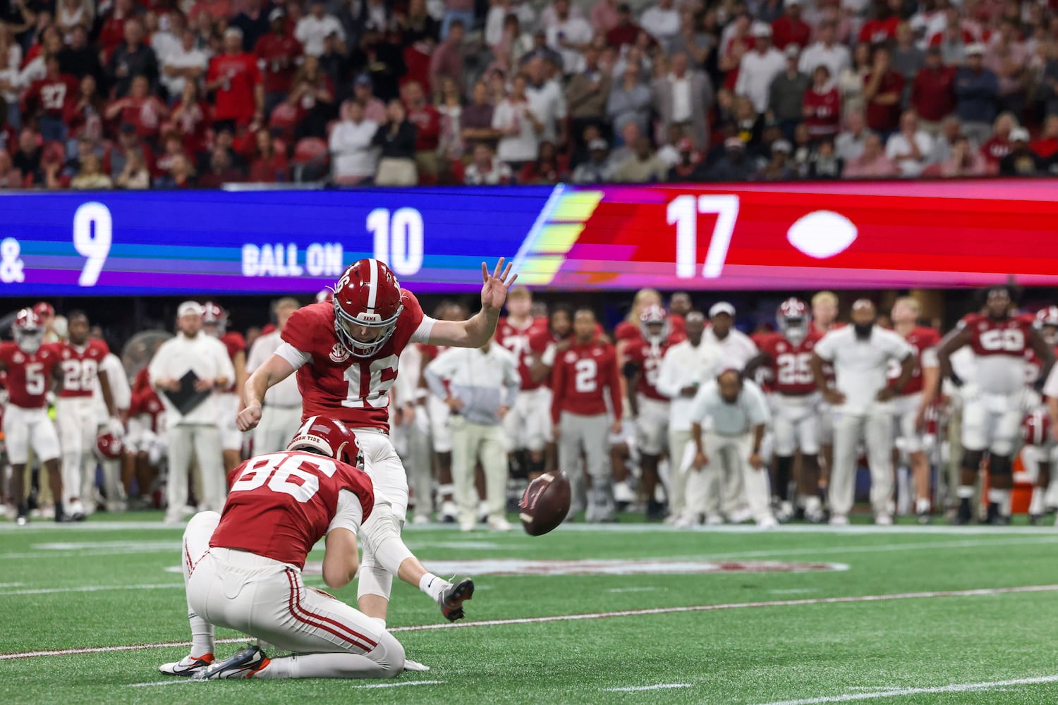 Alabama Crimson Tide place kicker Will Reichard (16) kicks a 28 yard field goal against the Georgia Bulldogs during the second half of the SEC Championship football game at the Mercedes-Benz Stadium in Atlanta, on Saturday, December 2, 2023. (Jason Getz / Jason.Getz@ajc.com)