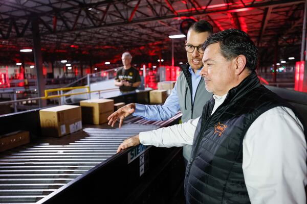 Chief Supply Officer of Honey Baked Ham Greg Hundt (right) and Michael Sloan (left), the vice president of customer solutions at UPS, oversaw the delivery of Honey Baked Ham products on Wednesday, Nov. 20, 2024. The hams were placed in boxes moving along conveyor belts entering the UPS S.M.A.R.T Hub. The Honey Baked Ham Company and UPS continue their partnership to ensure that meals are delivered on time for Thanksgiving across the nation.
(Miguel Martinez / AJC)