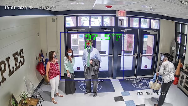 Fayette County schools in August installed 75 thermal imaging cameras at its schools to detect when people have elevated body temperatures. The district purchased the cameras, which are integrated in the district’s security system, from Hikavision for $525,000. Pictured here is a camera reading the temperature of School Superintendent Jonathan Patterson in the lobby of Peeples Elementary School. Credit: Fayette County schools