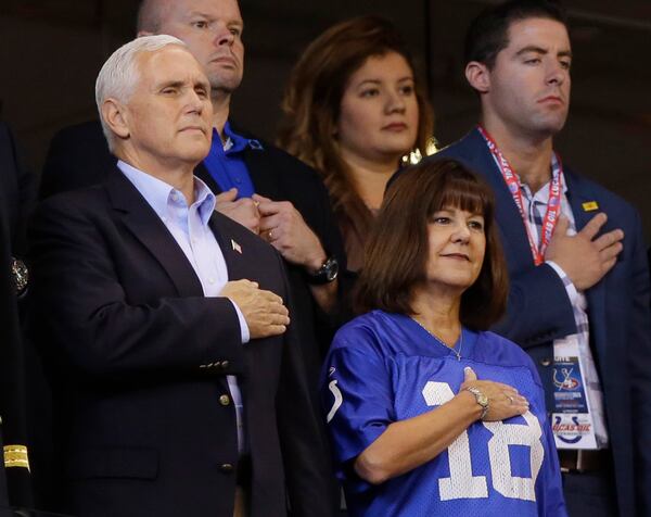 Vice President Mike Pence and his wife, Karen, stand during the playing of the national anthem before the NFL football game between the Indianapolis Colts and the San Francisco 49ers, on Sunday, Oct. 8, 2017, in Indianapolis.