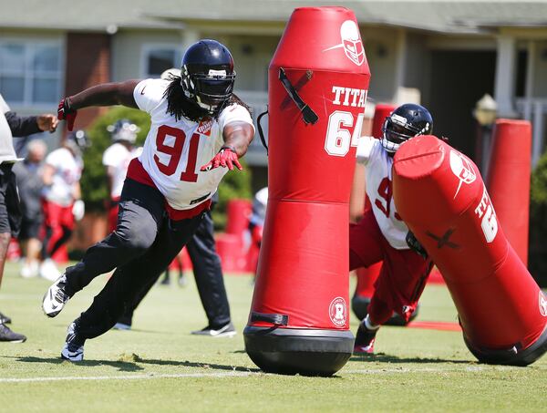 Atlanta Falcons linebacker Courtney Upshaw (91) works during a pass rushing drill during their NFL football practice Thursday, June 16, 2016, in Flowery Branch, Ga. He's the proverbial next man up at the defensive tackle position with Shelby on IR. (AP Photo/John Bazemore)