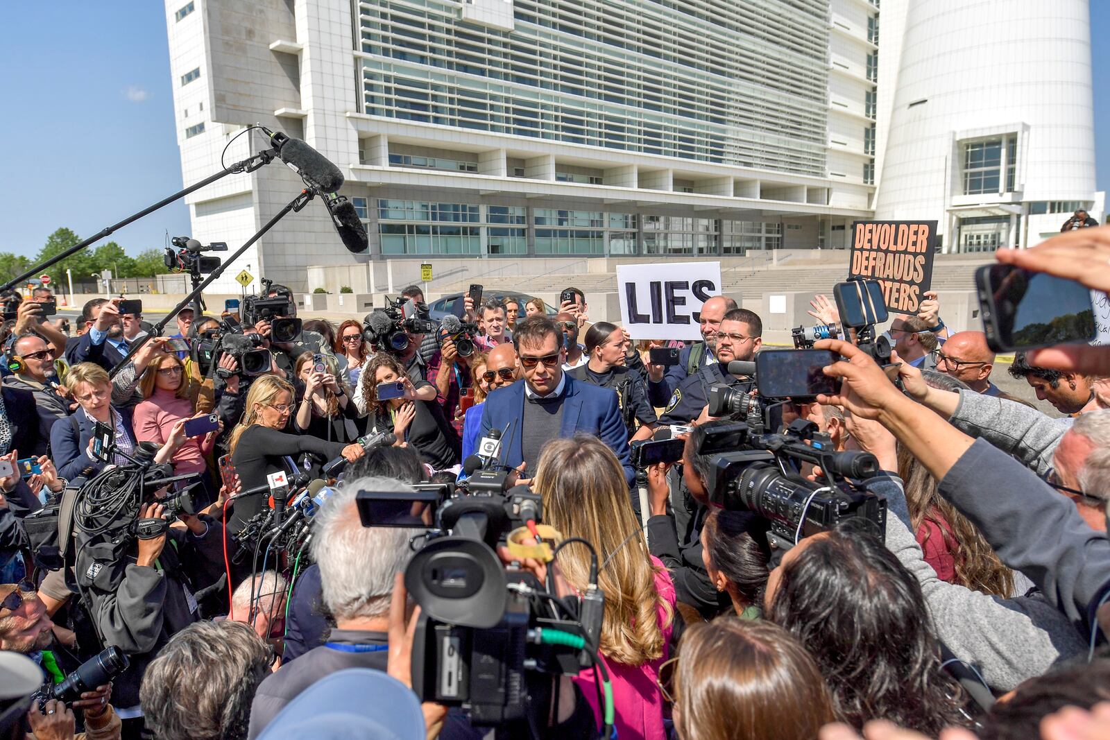 U.S. Rep. George Santos (R-N.Y.) leaves federal court in Central Islip, N.Y., May 10, 2023. The scandal-plagued congressman, who ran on a life story littered with lies, was charged in a wide-ranging indictment with wire fraud, money laundering, stealing public funds and lying on federal disclosure forms. (Johnny Milano/The New York Times)
                      