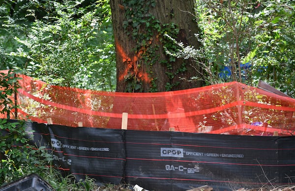 Photo shows trees marked for removal on a property in Reynoldstown on Thursday, September 8, 2022. (Hyosub Shin / Hyosub.Shin@ajc.com)