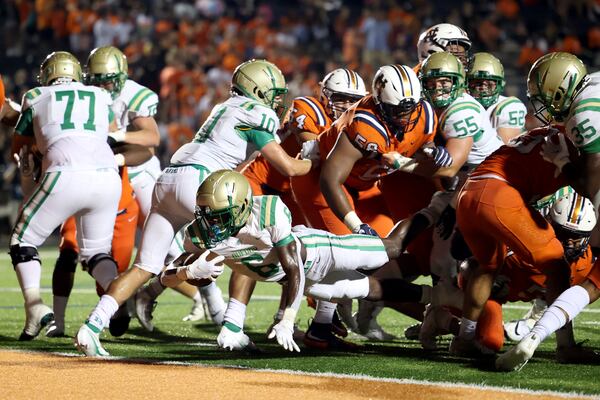 Buford running back Victor Venn (6) scores a touchdown during the second half against North Cobb Friday, Aug. 20, 2021, in Kennesaw. Buford won 35-27. (Jason Getz/For the AJC)