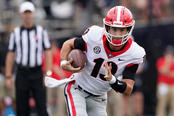 Georgia quarterback Stetson Bennett scrambles against Vanderbilt in the first half of an NCAA college football game Saturday, Sept. 25, 2021, in Nashville, Tenn. (AP Photo/Mark Humphrey)