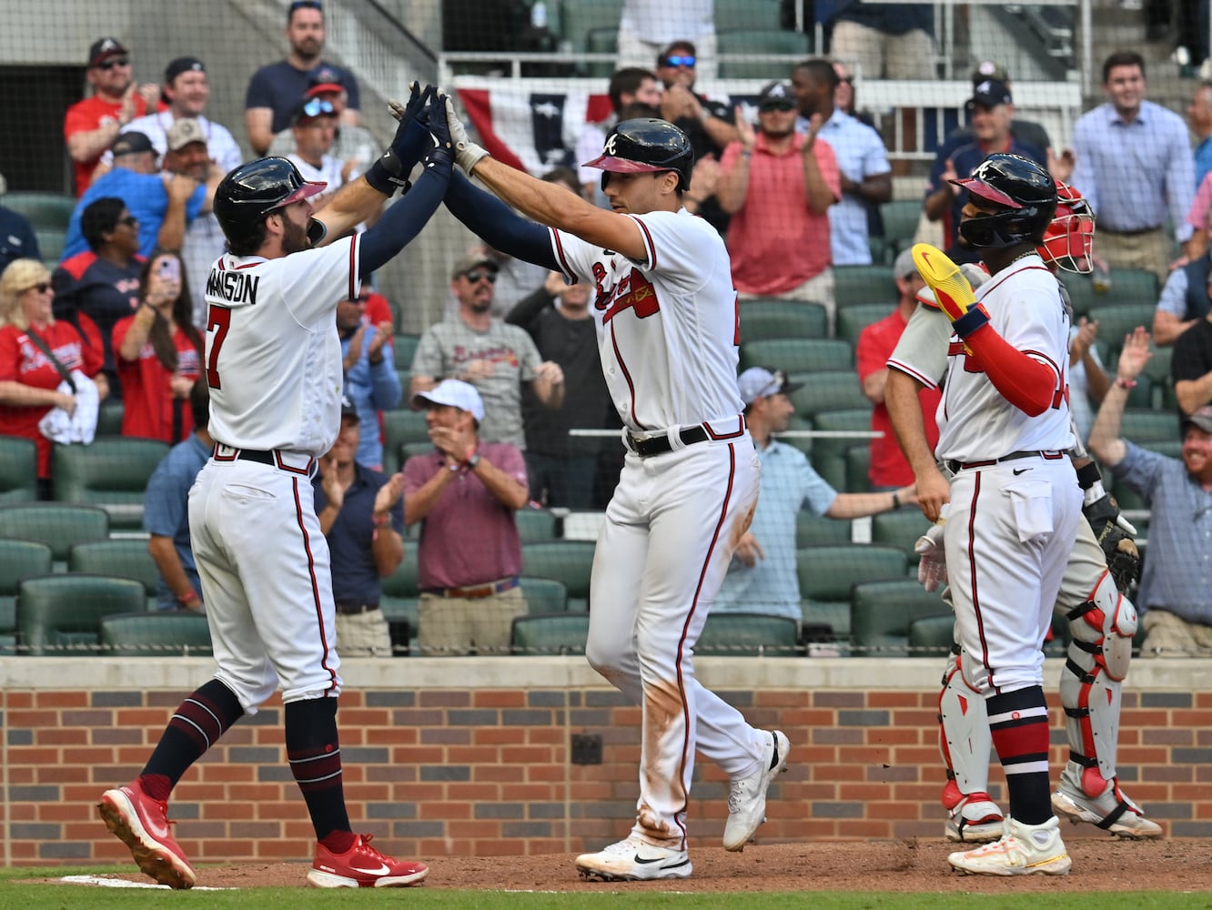 Atlanta Braves' Matt Olson hits a three-run homer during the ninth inning of game one of the baseball playoff series between the Braves and the Phillies at Truist Park in Atlanta on Tuesday, October 11, 2022. (Hyosub Shin / Hyosub.Shin@ajc.com)