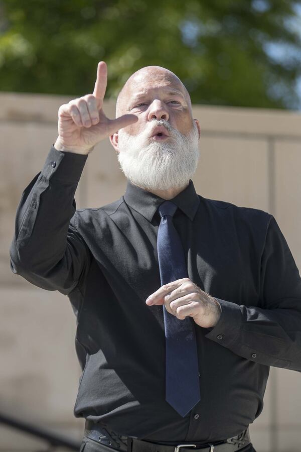 Georgia has approximately 300,000 deaf and hard-of-hearing individuals, and David Cowan, an American Sign language deaf interpreter with All Hands On, conveys critical information to them by interpreting remarks made by Gov. Brian Kemp at events such as this April 20, 2020, press conference at Liberty Plaza in Atlanta. 