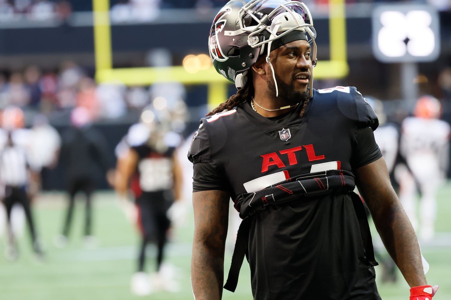 Falcons running back Cordarrelle Patterson takes a break during warmups before the game against the Browns on Sunday. (Miguel Martinez / miguel.martinezjimenez@ajc.com)