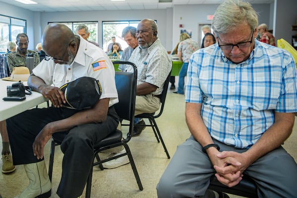 Participants take a moment to mourn the victim during the Lemuel Penn remembrance ceremony in Madison County on Thursday, July 11, 2024.  (Ziyu Julian Zhu / AJC)