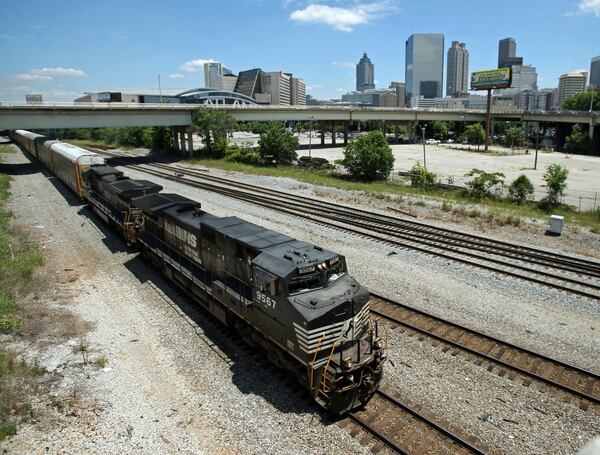 A Norfolk-Southern train travels south close to the Mitchell Street bridge in the Gulch Tuesday afternoon in Atlanta, Ga., May 28, 2013. The railroad giant is expected to formally announce its relocation to Atlanta at a press conference on Wednesday. JASON GETZ / JGETZ@AJC.COM