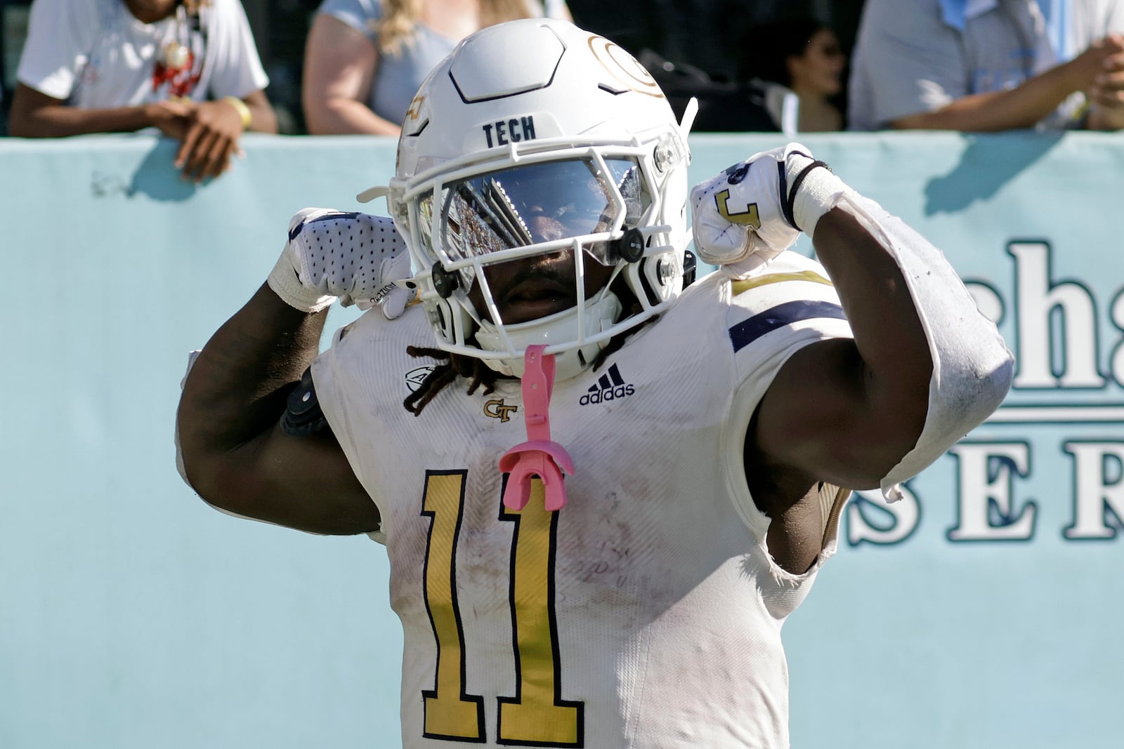 Georgia Tech running back Jamal Haynes (11) celebrates after he scored the winning touchdown on a long run in the closing seconds of an NCAA college football game against North Carolina, Saturday, Oct. 12, 2024, in Chapel Hill, N.C. (AP Photo/Chris Seward)