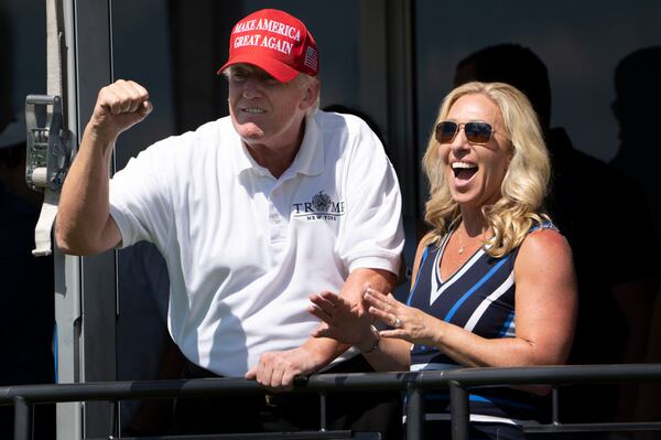 Former President Donald Trump and Rep. Marjorie Taylor Greene (R-Ga.) at Trump National Golf Club in Bedminster, N.J., July 31, 2022. Greene has been a fierce supporter of Trump. (Doug Mills/The New York Times)