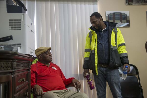 EGM Services Inc. apprentice Keith Davis (right) talks with EGM Services Inc. founder and chairman of the board Arthur Queen at the office in Decatur Jan. 24, 2020. Queen credits Maynard Jackson’s set-aside program, which started in the 1970s, with helping him and many other black business owners. ALYSSA POINTER / ALYSSA.POINTER@AJC.COM