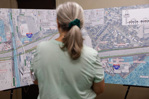 Dunwoody resident Mimi Deupree looks at maps during a recent GDOT open house to discuss the I-285 toll lanes project.