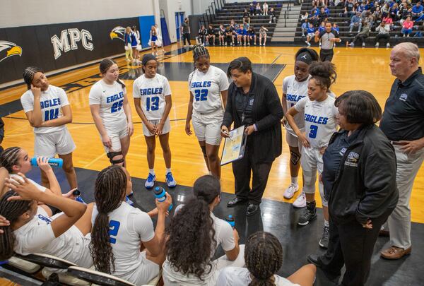 Mount Paran Christian School’s head girls basketball coach Stephanie Dunn coaches her team to a victory again the Athens Academy Spartans in second half action on Friday, Feb 23, 2024.  Mt Paran won the game 77 to 34.  (Jenni Girtman for The Atlanta Journal-Constitution)