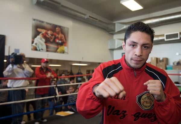 FILE - WBC and The Ring magazine super bantamweight champion Israel Vázquez works out at the South El Monte Boxing Club, in El Monte, Calif., Feb. 25, 2008. The World Boxing Council (WBC) president confirmed on Tuesday, Dec. 3, 2024, that Israel Vázquez, a Mexican fighter who won three world titles in his boxing career, has died. He was 46. (AP Photo/Damian Dovarganes, File)