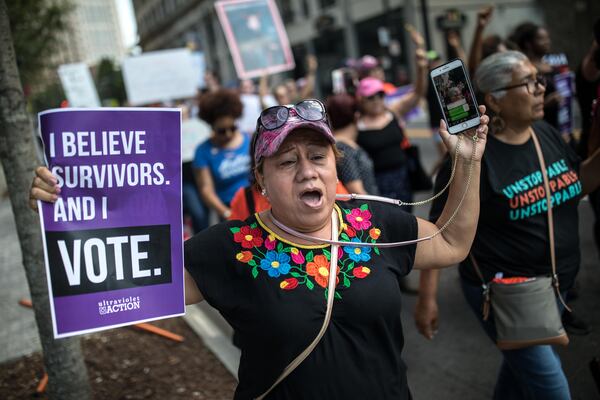 "I believe survivors. And I vote" said this protester's sign at a demonstration Saturday, Oct. 8, 2018, in Atlanta before the expected confirmation of U.S. Supreme Court nominee Brett Kavanaugh. (Photo: BRANDEN CAMP/Contributed)