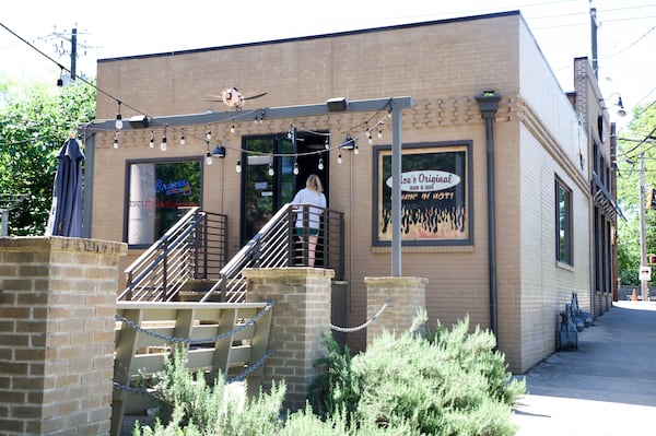 A customer enters Moe’s Original BBQ Monday. 