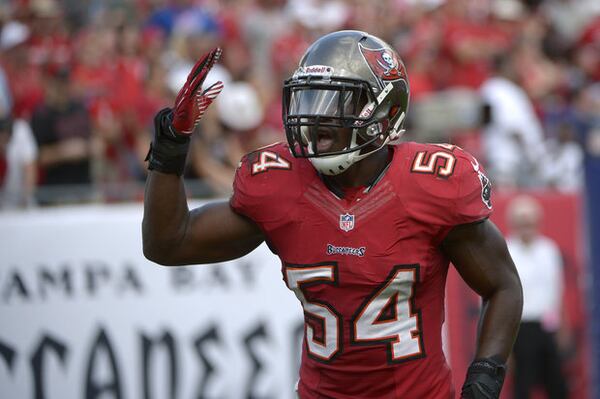 Tampa Bay outside linebacker Lavonte David (54) celebrates after running back an interception for a touchdown against the Buffalo Bills last season at Raymond James Stadium. (ASSOCIATED PRESS)