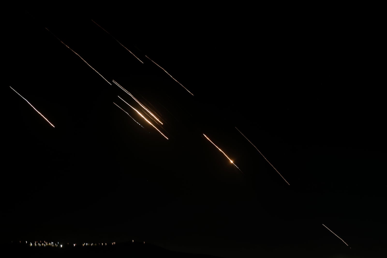 FILE - Missiles launched from Iran towards Israel are seen in the West Bank city of Nablus Tuesday, Oct. 1, 2024. (AP Photo/Majdi Mohammed, File)