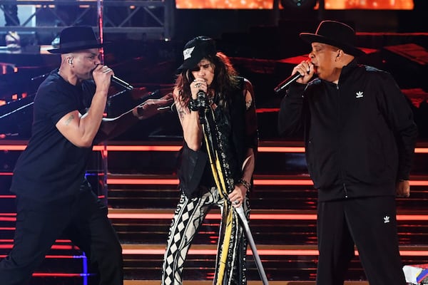 Joseph Simmons (left) of music group Run?D.M.C., Steven Tyler of music group Aerosmith, and Darryl McDaniels of music group Run?D.M.C. perform onstage during the 62nd Annual GRAMMY Awards at STAPLES Center on January 26, 2020 in Los Angeles, California. (Kevin Winter/Getty Images for The Recording Academy/TNS)