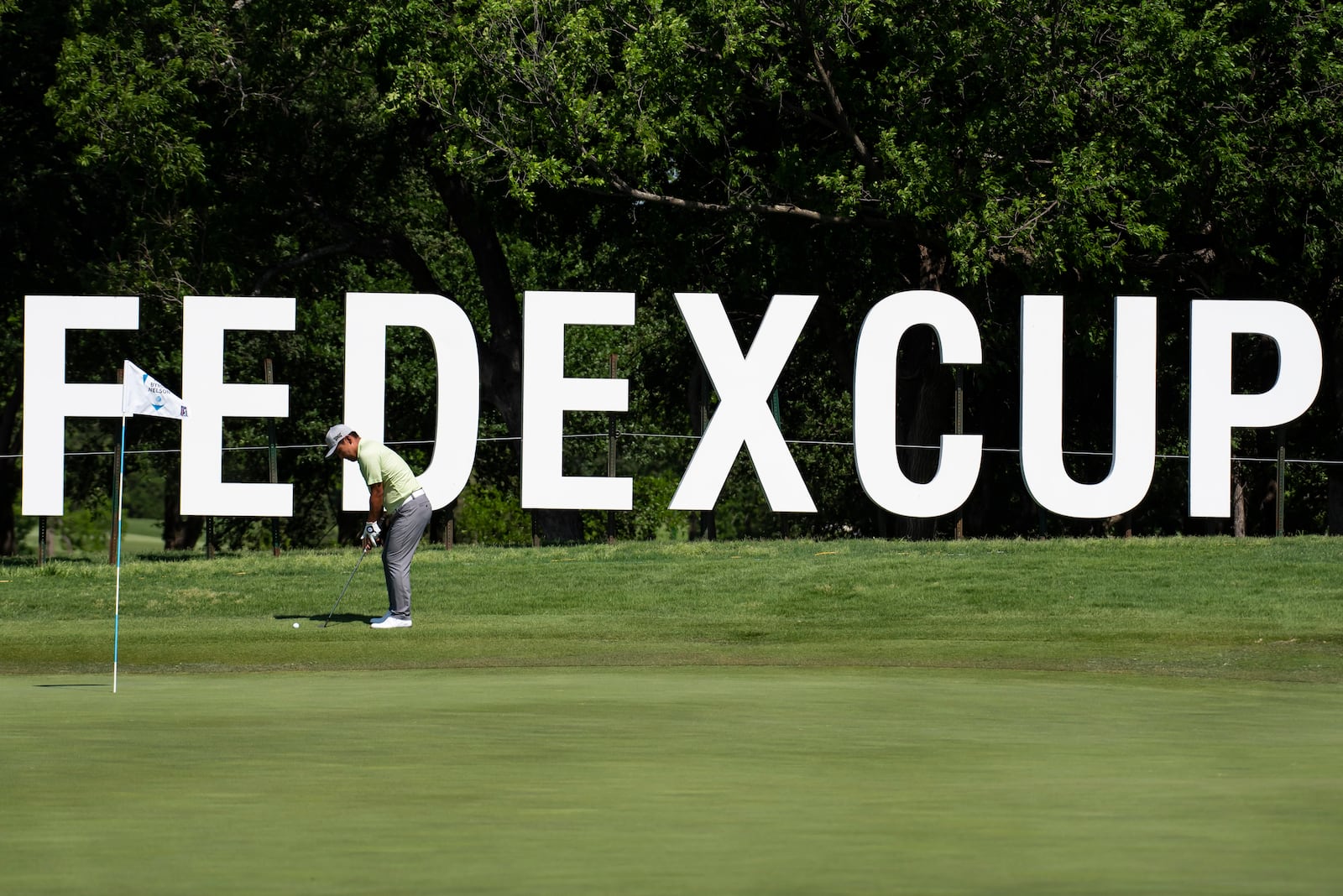 FILE - Sung Kang, of South Korea, hits a shot off of the 10th hole during the first round of the AT&T Byron Nelson golf tournament in McKinney, Texas, on Thursday, May 12, 2022. (AP Photo/Emil Lippe, File)