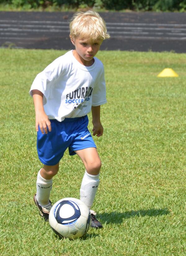 A youngster sets up a shot at Future Stars Soccer Academy held at Oglethorpe University. Courtesy of Future Stars Soccer Academy