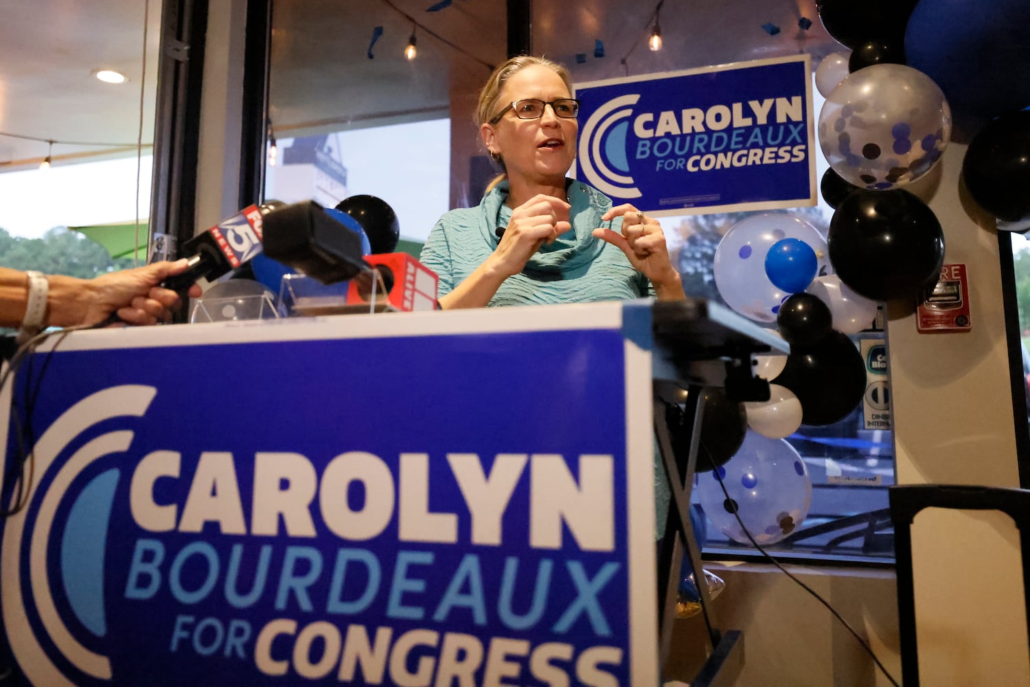 Rep. Carolyn Bourdeaux speaks to her supporters during the Election Night Watch Party at KettleRock Brewing on Tuesday, May 24, 2022. According to the Election Chef, they would know the result around 10:30. Miguel Martinez / miguel.martinezjimenez@ajc.com