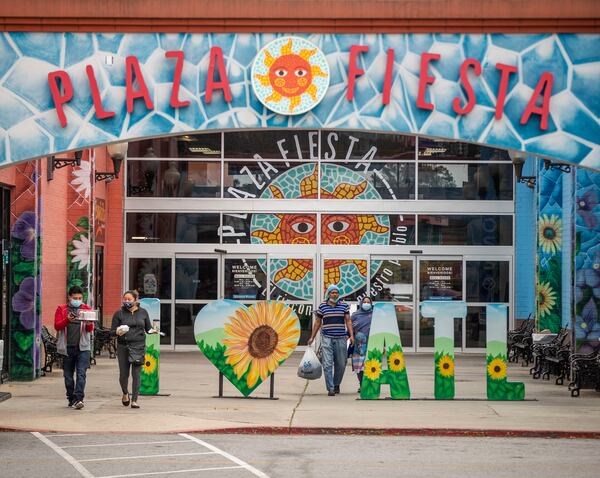 Shoppers exit Plaza Fiesta in this AJC file photo. (Alyssa Pointer / Alyssa.Pointer@ajc.com)