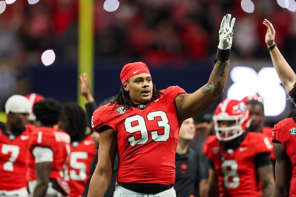 Georgia defensive lineman Tyrion Ingram-Dawkins (93) celebrates the start of the fourth quarter during their game against Texas in the 2024 SEC Championship game at Mercedes-Benz Stadium, Saturday, December 7, 2024, in Atlanta. Georgia won 22-19 in overtime. Jason Getz / AJC)
