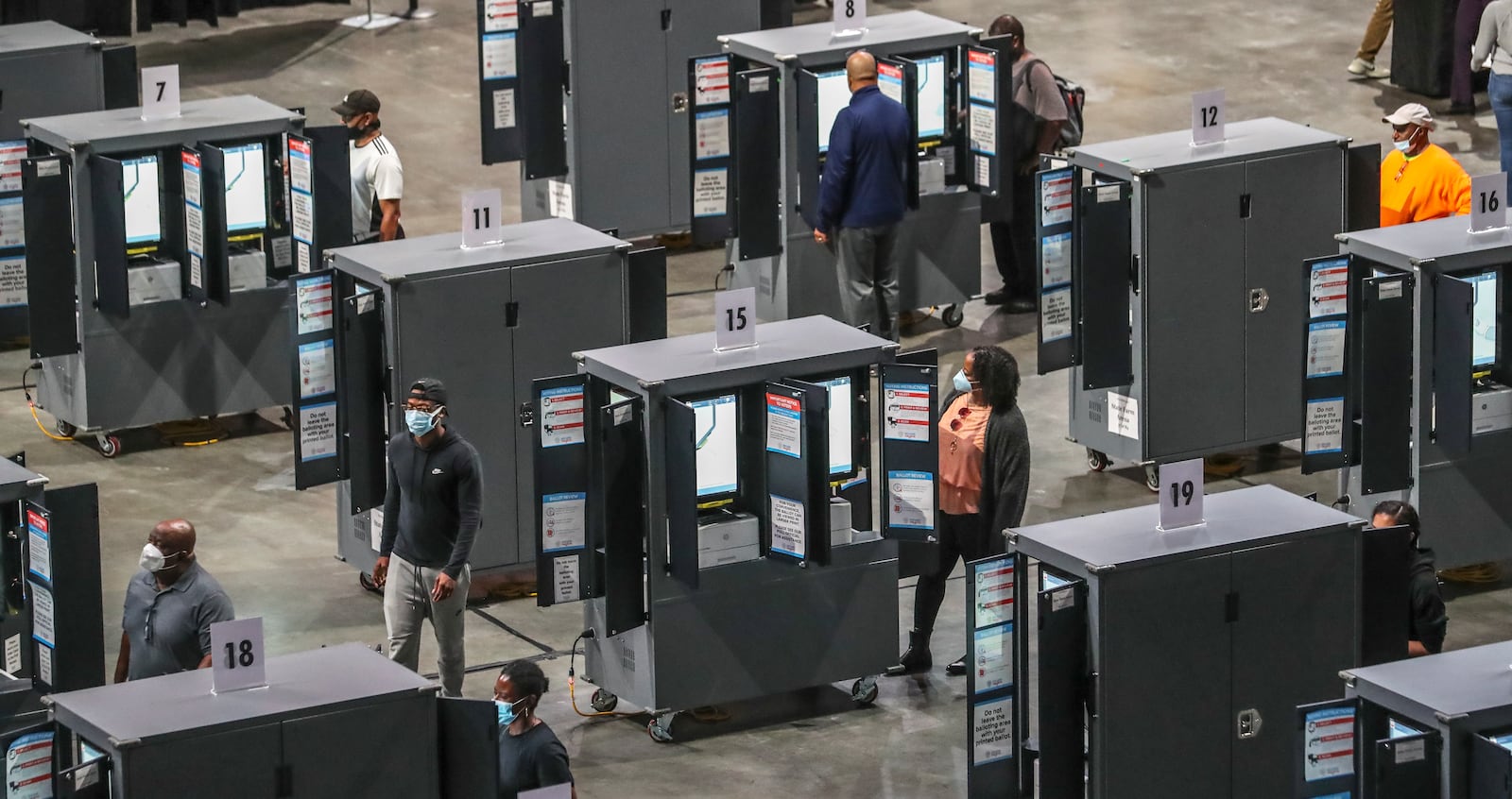 Eager Georgia voters swarmed to polling places such as State Farm Arena in Fulton at the start of three weeks of early voting before Election Day in 2020. (John Spink / John.Spink@ajc.com)

