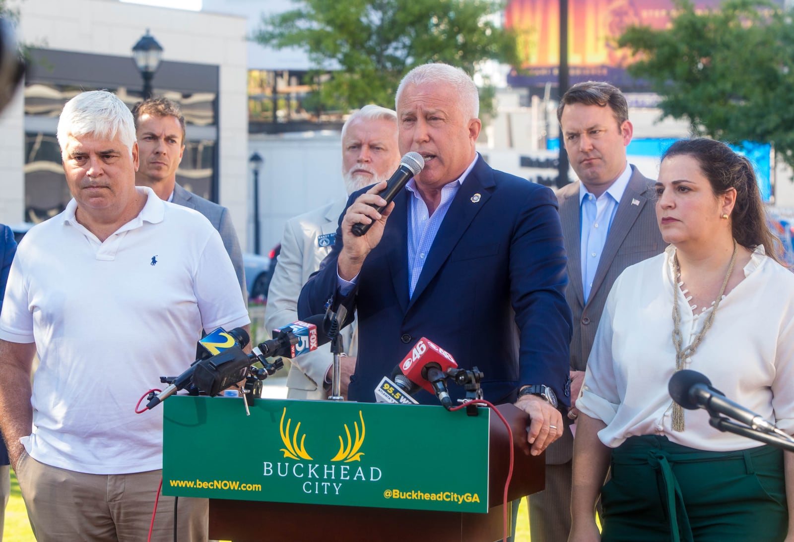 Buckhead City supporters, including Bill White, at podium, who is the Buckhead City Committee Chairman and CEO as well as area senators, local residents and some opposed to the creation of a new city gather for a press conference at Loudermilk Park on Wednesday, Sept 29, 2021.  The group announced that during the upcoming special legislative session the bill will be discussed.  Several state senators signed the bill onsite, illustrating support in the state Senate.  (Jenni Girtman for The Atlanta Journal-Constitution)