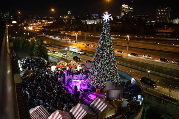 A large Christmas tree lights up during the Light the Station 2018 holiday event Saturday, November 17, 2018, at Atlantic Station in Atlanta. (Photo: STEVE SCHAEFER / SPECIAL TO THE AJC)