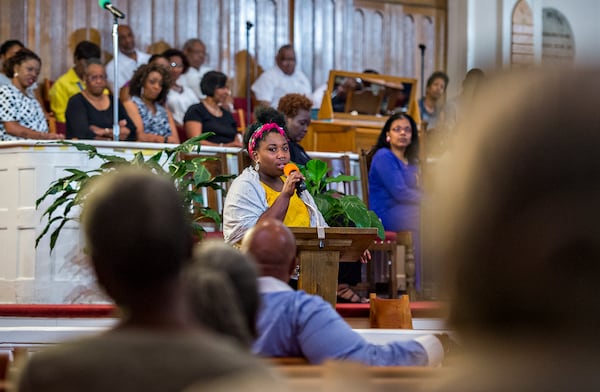 Aurielle Marie Lucier (center), spokesperson for the Atlanta social justice organization #ItsBiggerThanYou, speaks during a special service at Big Bethel A.M.E. Church in Atlanta on June 19, 2015. The Prayer, Healing and Reconciliation Service honored the nine members of Emanuel A.M.E. Church in Charleston, S.C., who lost their lives that week in a racially motivated mass shooting. (JONATHAN PHILLIPS / SPECIAL)