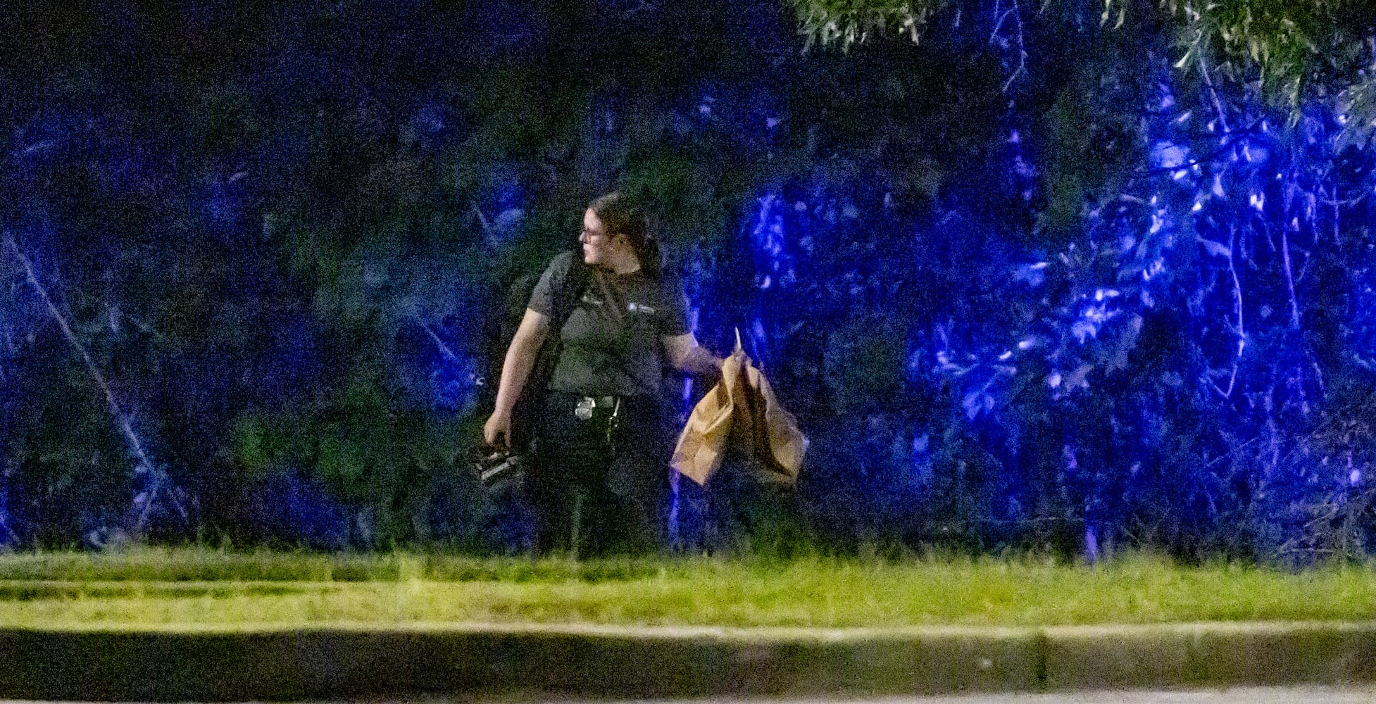 Investigators examine the scene of a shooting, where a man and three children shot to death inside a car at Lucky Shoals Park outside of Tucker on Wednesday, May 8, 2024. The man was in the driver’s seat. He, a boy and two girls all appeared to have been shot. Their names and ages were not released, but authorities said the children appeared to have been in elementary and middle school.  (John Spink/AJC)