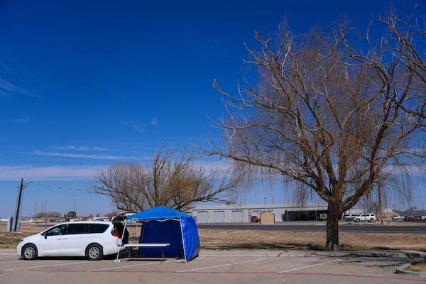 A van is seen at the site of a measles testing location on the parking lot of Seminole Hospital District Friday, Feb. 21, 2025, in Seminole, Texas. (AP Photo/Julio Cortez)