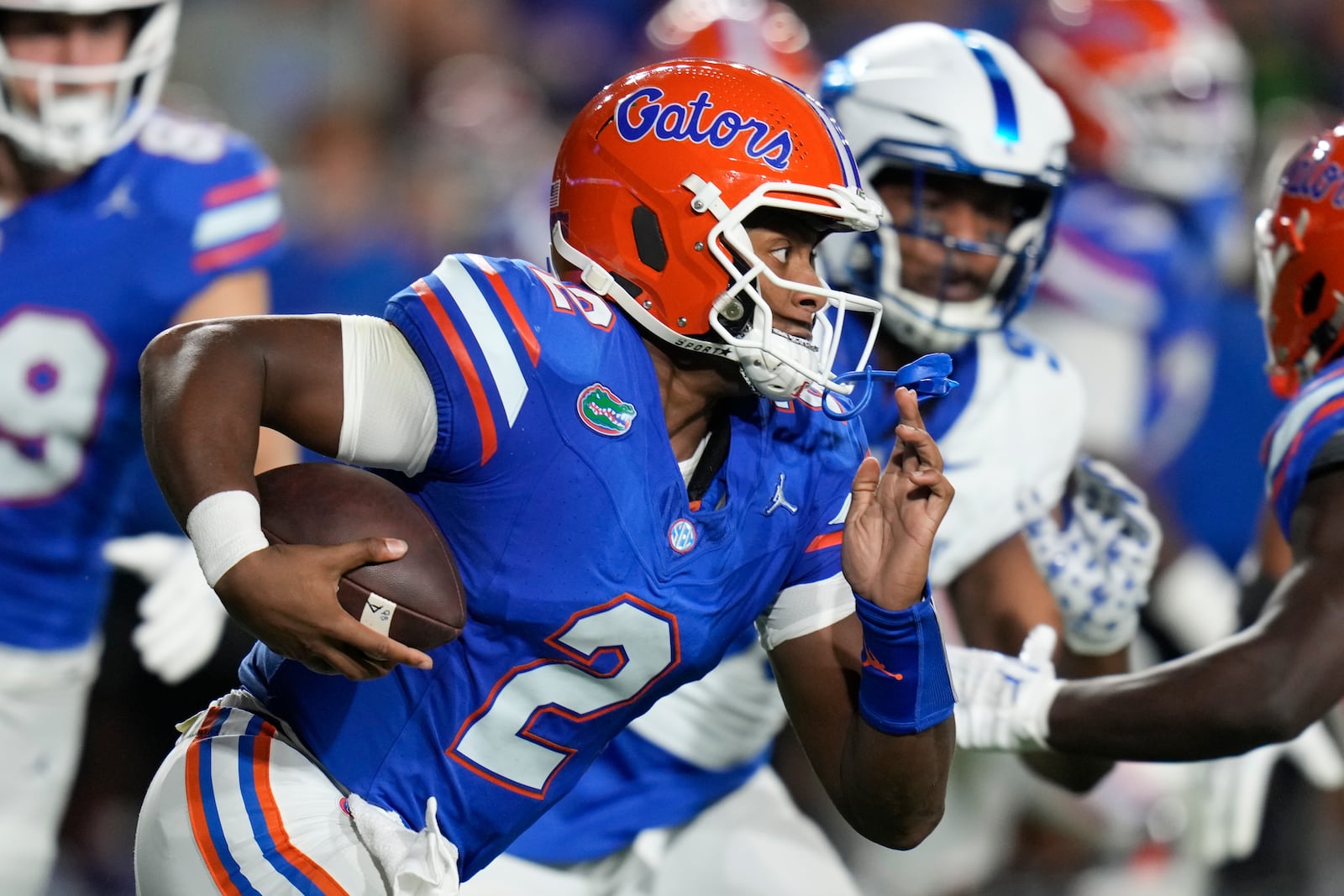 Florida quarterback DJ Lagway (2) scrambles out of the pocket against Kentucky during the first half of an NCAA college football game, Saturday, Oct. 19, 2024, in Gainesville, Fla. (AP Photo/John Raoux)