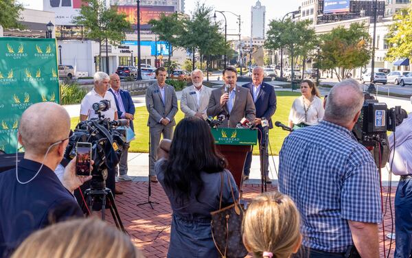 Buckhead City supporters, including State Senator Burt Jones at podium, as well as other area senators, local residents and some opposed to the creation of a new city gather for a press conference at Loudermilk Park on Wednesday, Sept 29, 2021.  The group announced that during the upcoming special legislative session the bill will be discussed.  Several state senators signed the bill onsite, illustrating support in the state Senate.  (Jenni Girtman for The Atlanta Journal-Constitution)