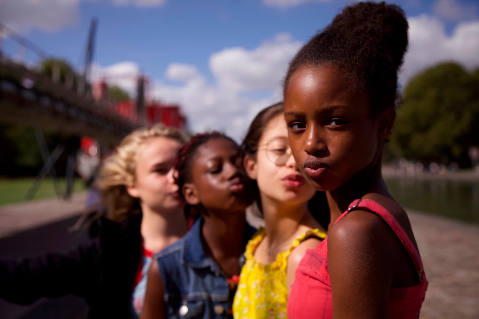 This image released by Netflix shows the cast of the coming-of-age film "Cuties." The backlash to the French independent film “Mignonnes,” or “Cuties,” started before it had even been released because of a poster that went viral for its provocative depiction of its young female actors.