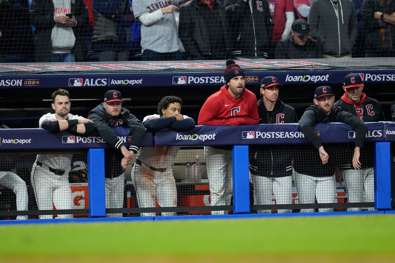 Cleveland Guardians players watch from the dugout during the ninth inning in Game 4 of the baseball AL Championship Series against the New York Yankees Friday, Oct. 18, 2024, in Cleveland. The Yankees won 8-6. (AP Photo/Godofredo A. Vásquez)