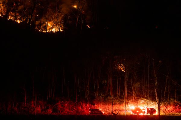 Firefighters attend the wildfires as they burn along the New York and New Jersey border in Greenwood Lake, New York, Wednesday, Nov. 13, 2024. (AP Photo/Eduardo Munoz Alvarez)