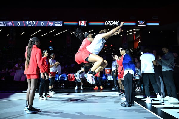 Atlanta Dream forward Cheyenne Parker-Tyus (32) gets fired up with a teammate before the start of WNBA game against Washington Mystics at the Gateway Center Arena on June 11, 2024, in Atlanta. (Hyosub Shin / AJC)