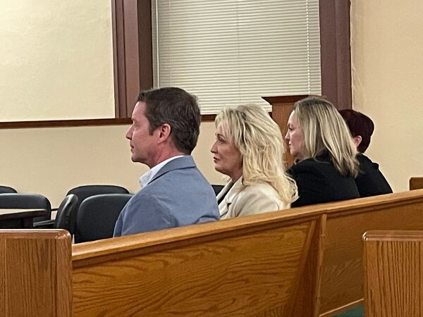 Uri Rubin, CEO of Senior Living Management, (left) sits next to Tori Grober, the Corporate Director Of Operations, (center) as they attend the January 3 notice of revocation court hearing for Savannah Court of Lake Oconee, a senior care facility the company operates in Greensboro, Georgia. Allie Gross/Allie.Gross@ajc.com