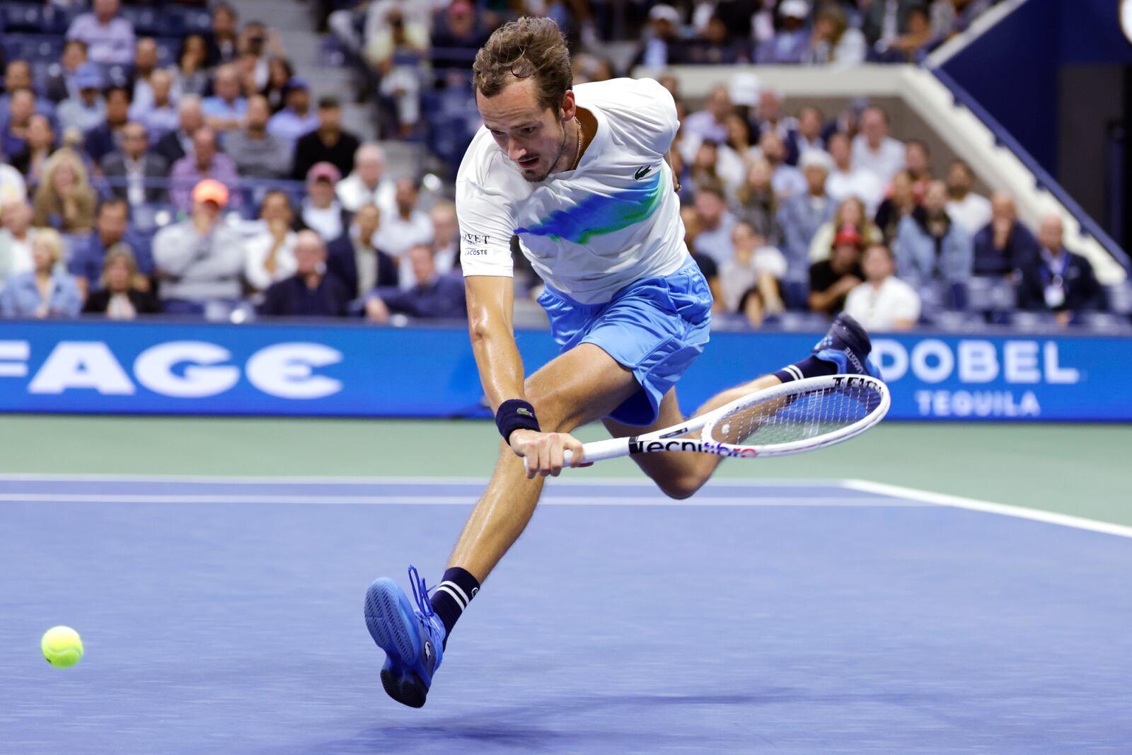 Daniil Medvedev, of Russia, chases the ball on a return to Jannik Sinner, of Italy, during the quarterfinals of the U.S. Open tennis championships, Wednesday, Sept. 4, 2024, in New York. (AP Photo/Adam Hunger)